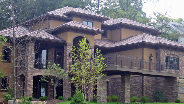 Creating a Southwestern look with stone veneer and Spanish shingles.